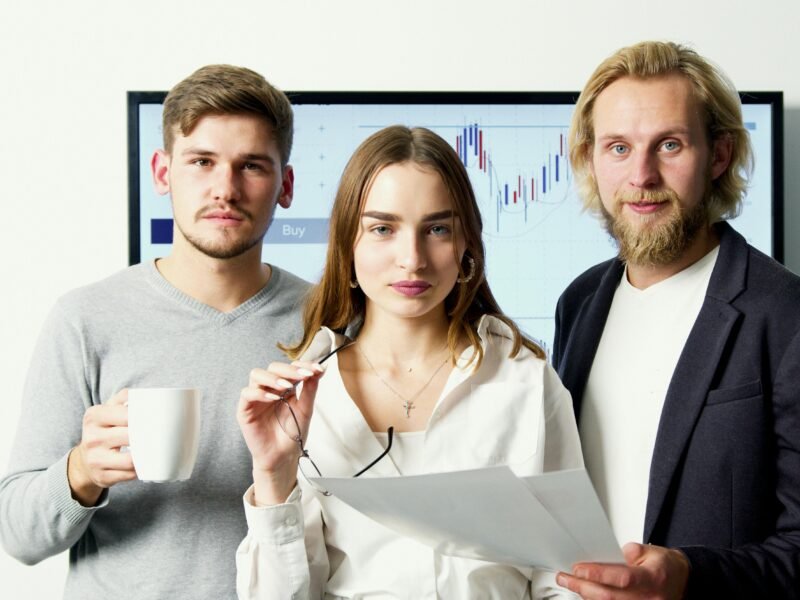 Professional business team discussing financial charts during a meeting in a modern office.