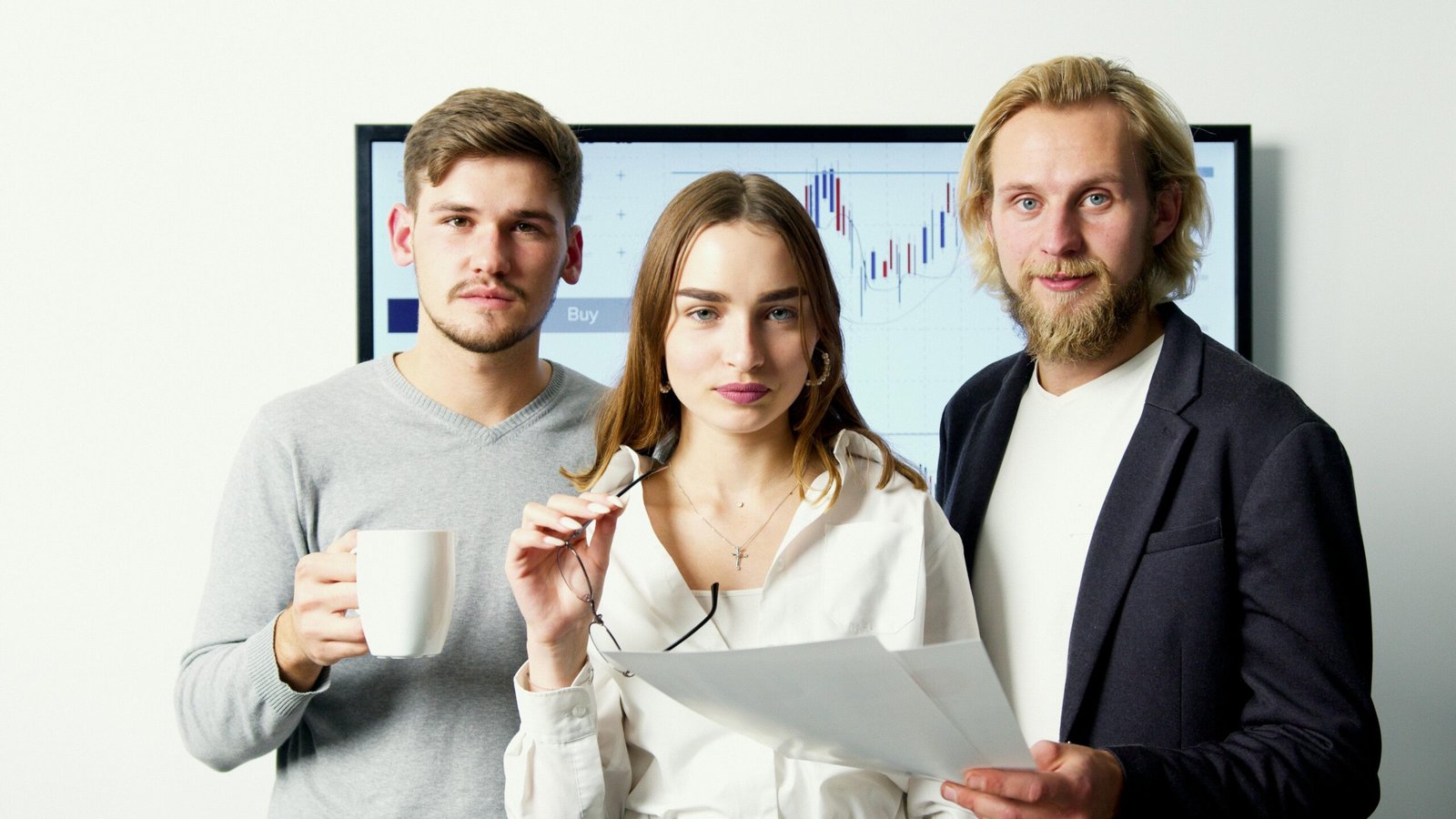 Professional business team discussing financial charts during a meeting in a modern office.